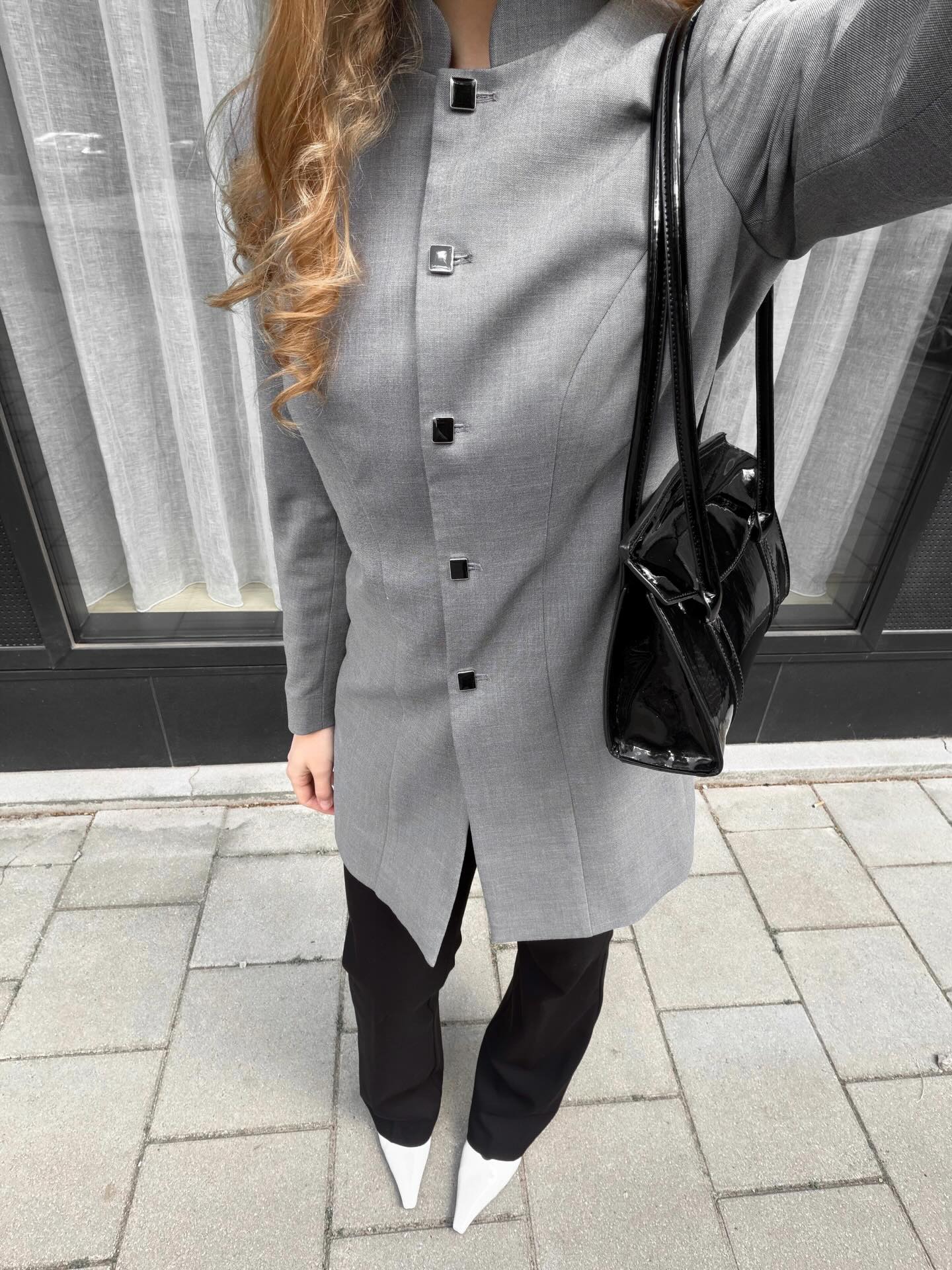 A Gray Double-Breasted Blazer with Black Trousers and White Shoes